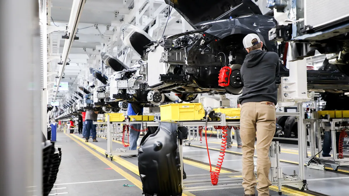 Worker inside Toyota's $1.3 billion EV plant in Georgetown, Kentucky.